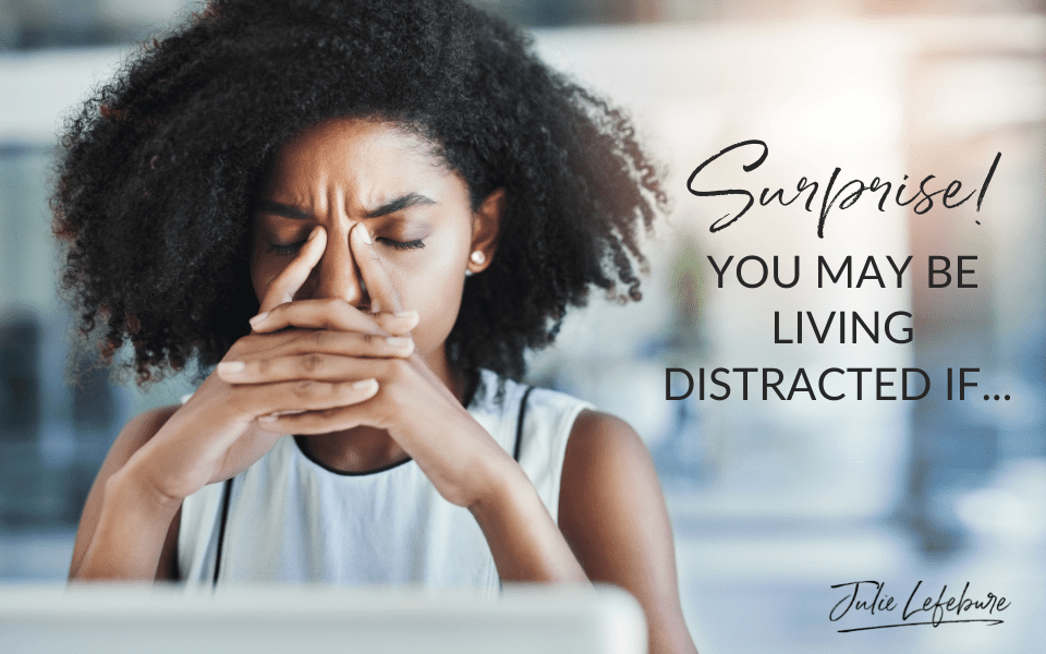 Surprise! You May Be Living Distracted If... | woman sitting in front of laptop with eyes closed and head resting on hands