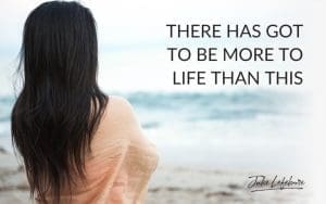 There Has Got to Be More to Life Than This | dark-haired woman dressed in a peach wrap facing a body of water
