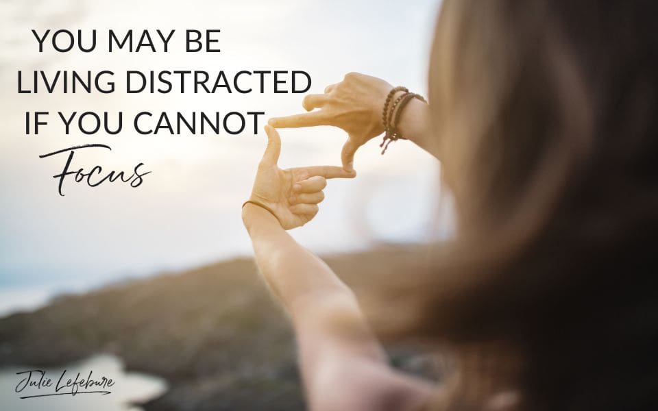 You May Be Living Distracted if You Cannot Focus | woman holding hands out with focus square