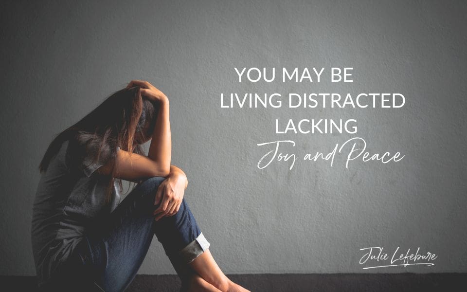 You May Be Living Distracted Lacking Joy and Peace | woman sitting on floor with head in hand, discouraged