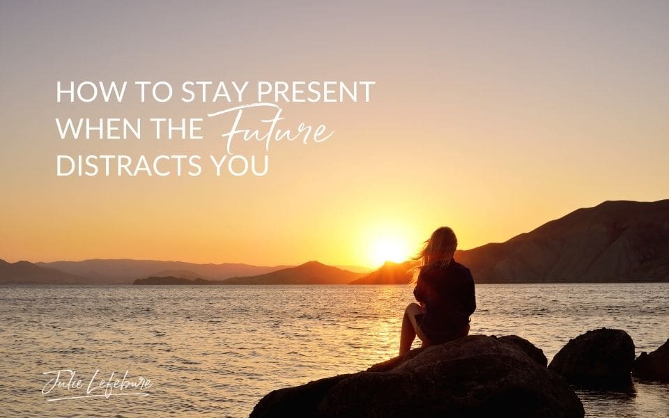 How to Stay Present When the Future Distracts You | woman facing sunset and a body of water sitting on a rock 
