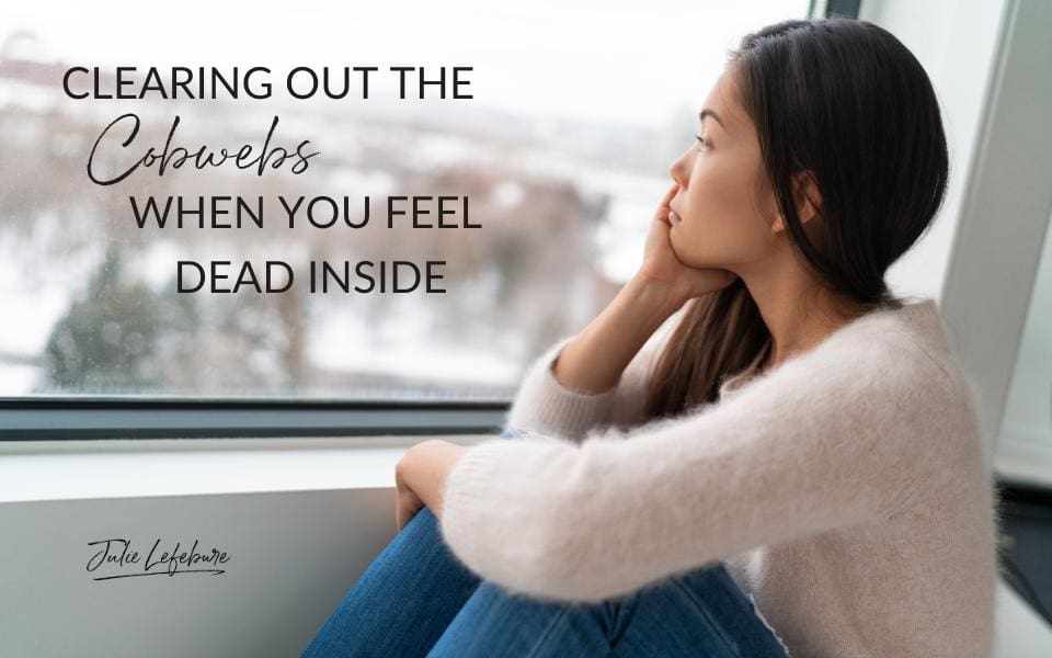 Clearing Out the Cobwebs When You Feel Dead Inside | woman in ivory sweater sitting, looking out window